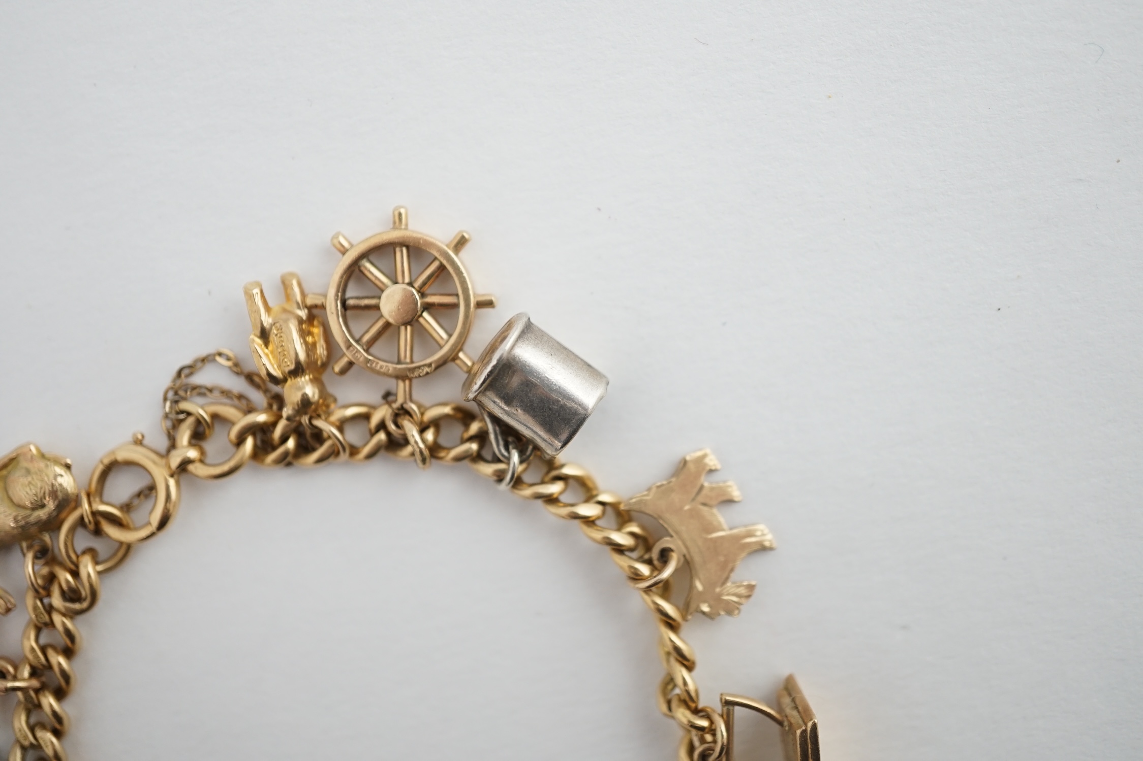 A 18ct gold charm bracelet